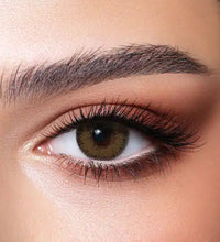 Close-up of a brown eye with detailed makeup. Bella Glow Glow Radiant Hazelnut.
