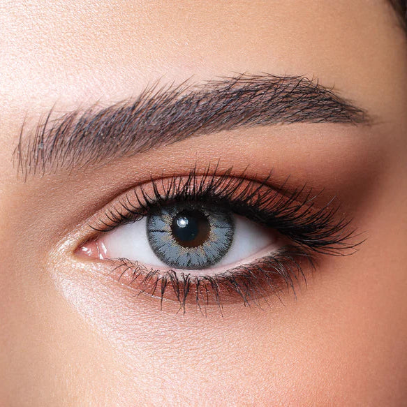Close-up of a woman's eye with detailed makeup. Bella Natural Viola Grey