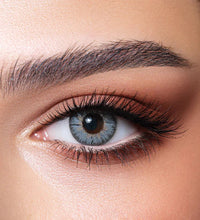 Close-up of a woman's eye with detailed makeup. Bella Natural Viola Grey