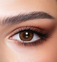 Close-up of a brown eye with detailed makeup. Bella One Day Almond Brown