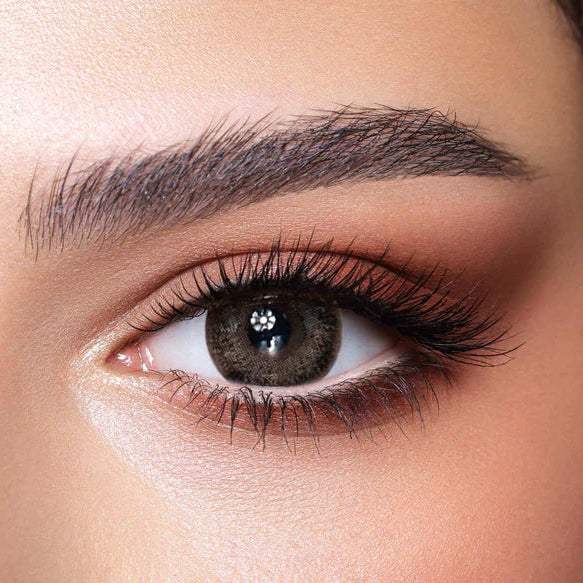 Close-up of a woman's eye with makeup. Bella One Day Ash Brown.