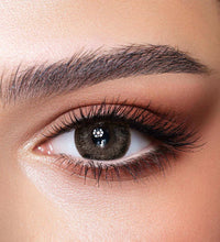 Close-up of a woman's eye with makeup. Bella One Day Ash Brown.