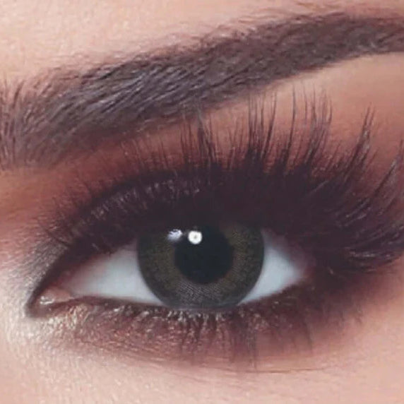 Close-up of a person's eye with makeup, including eyelashes and eyeliner. Bella_One_Day_Ash_Brown_2