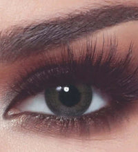 Close-up of a person's eye with makeup, including eyelashes and eyeliner. Bella_One_Day_Ash_Brown_2