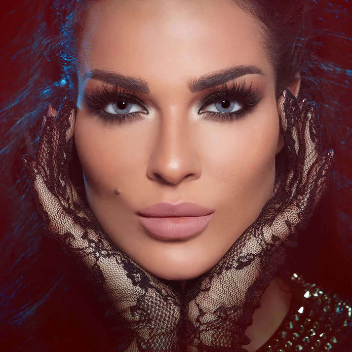 Woman wearing lace gloves with a dark, artistic background. Bella One Day Bluish Grey.