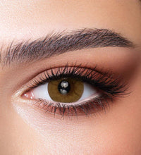 Close-up of a person's eye with detailed makeup. Bella One Day Citrine Crystal