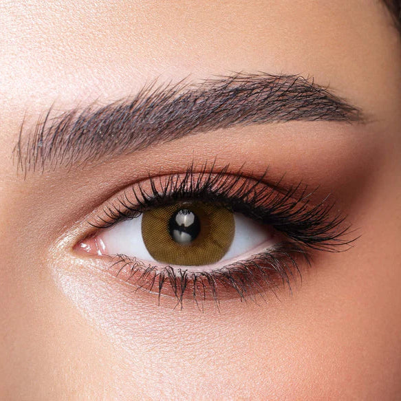 Close-up of a person's eye with detailed makeup. Bella One Day Citrine Crystal