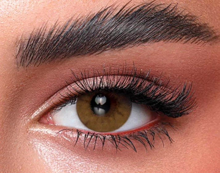 Close-up of a person's eye with detailed makeup. Bella One Day Citrine Crystal
