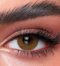 Close-up of a person's eye with detailed makeup. Bella One Day Citrine Crystal