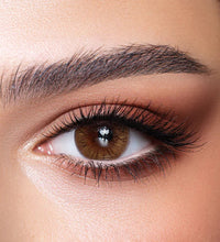 Close-up of a brown eye with makeup. Bella One Day Hazel Honey