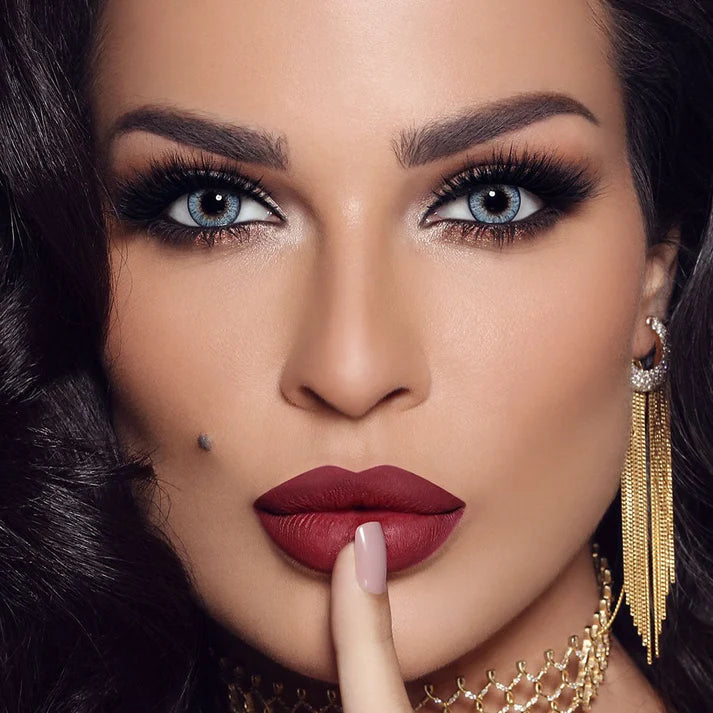 Close-up of a woman with dramatic makeup and jewelry Bella One Day Ocean Blue