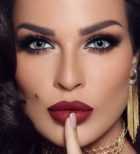 Close-up of a woman with dramatic makeup and jewelry Bella One Day Ocean Blue