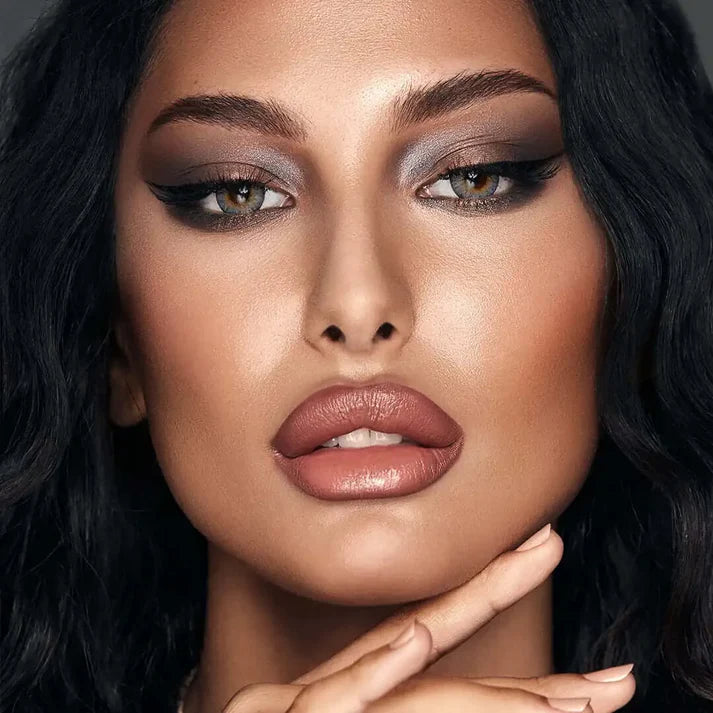 Close-up of a woman with makeup and dark hair. Bella One Day Ocean Blue