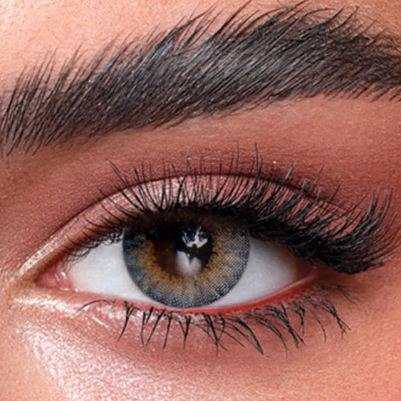 Close-up of a person's eye with detailed makeup. Bella One Day Ocean Blue