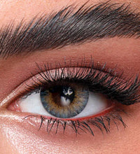 Close-up of a person's eye with detailed makeup. Bella One Day Ocean Blue